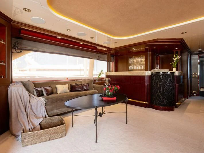 a living room with a couch and a coffee table aboard IL SOLE Yacht for Sale