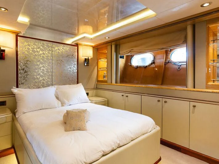 a bed with white sheets aboard IL SOLE Yacht for Sale