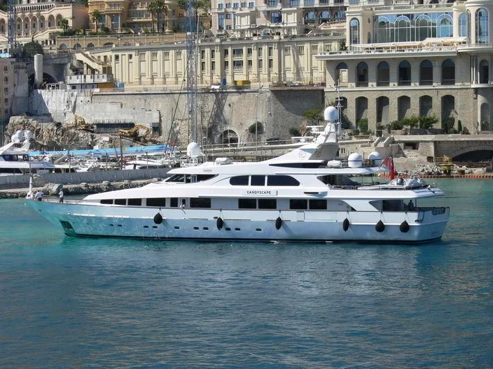 a white yacht in a harbor aboard IL SOLE Yacht for Sale