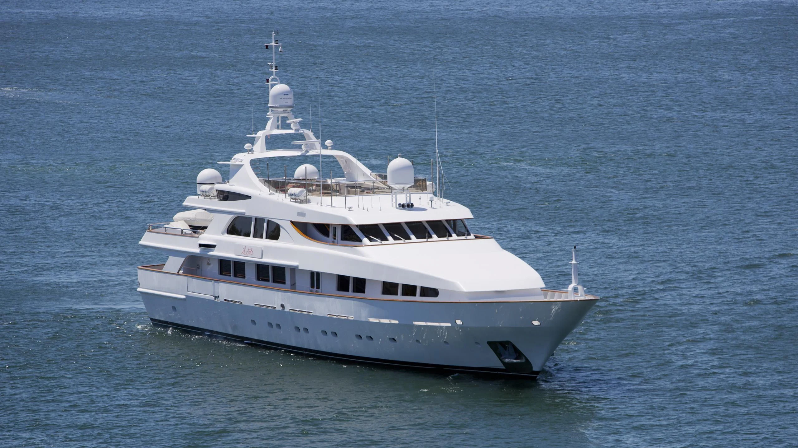 a large white boat in the water aboard IL SOLE Yacht for Sale