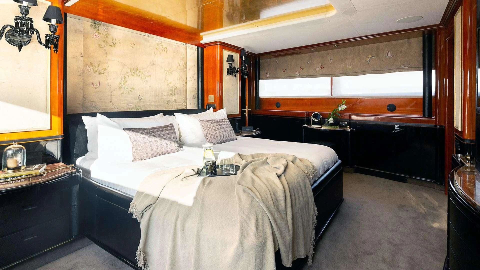 a room with a bed and a mirror aboard IL SOLE Yacht for Sale