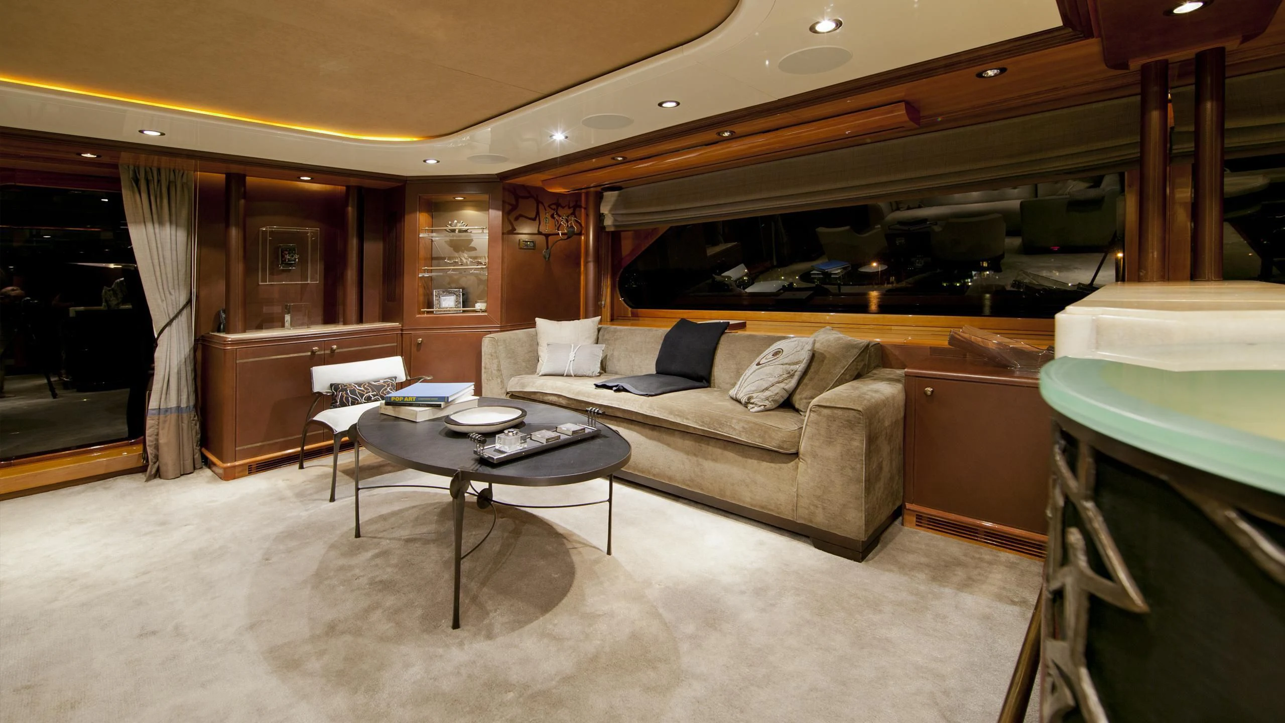 a living room with a couch and a table aboard IL SOLE Yacht for Sale