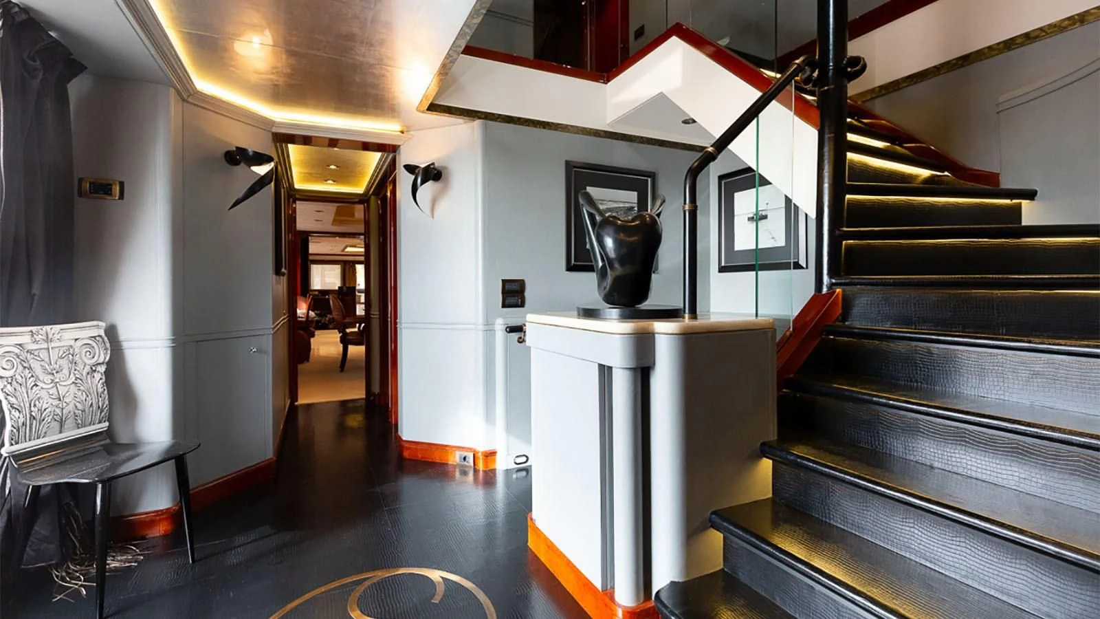 a room with a table and chairs aboard IL SOLE Yacht for Sale