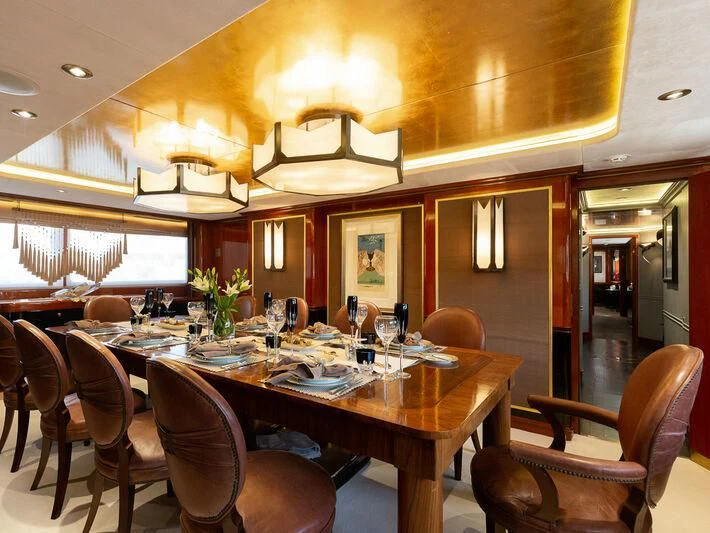 a dining room with a table set aboard IL SOLE Yacht for Sale