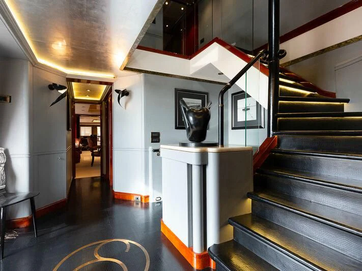 a room with a table and chairs aboard IL SOLE Yacht for Sale