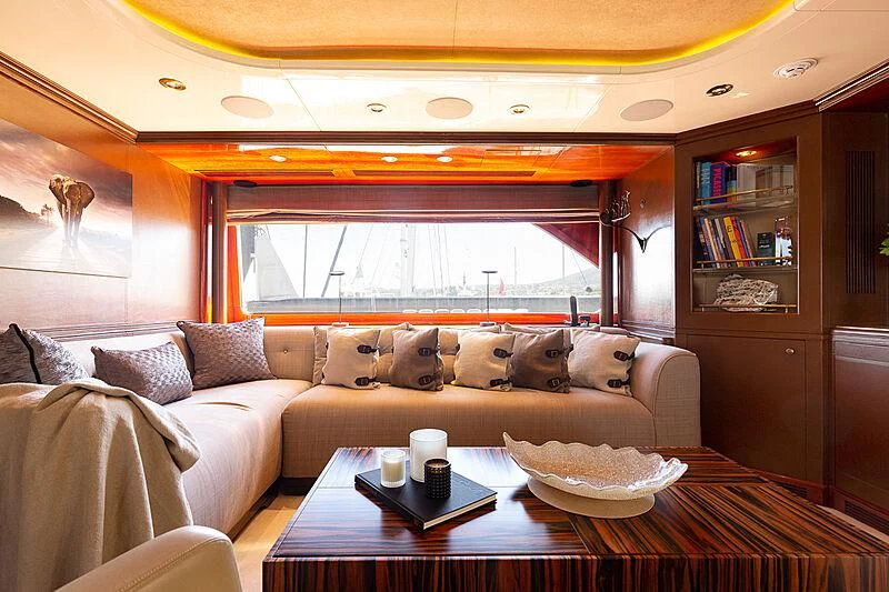 a living room with a couch and a table aboard IL SOLE Yacht for Sale