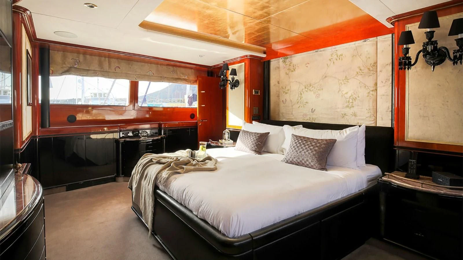 a room with a bed and a window aboard IL SOLE Yacht for Sale