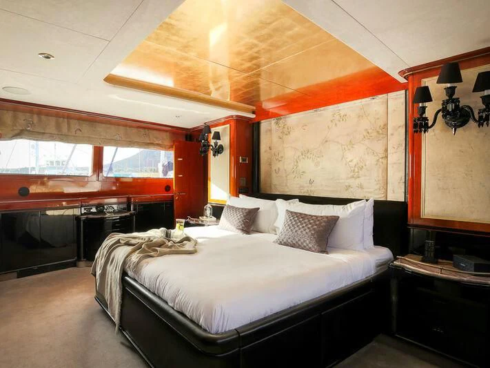 a room with a bed and a piano aboard IL SOLE Yacht for Sale