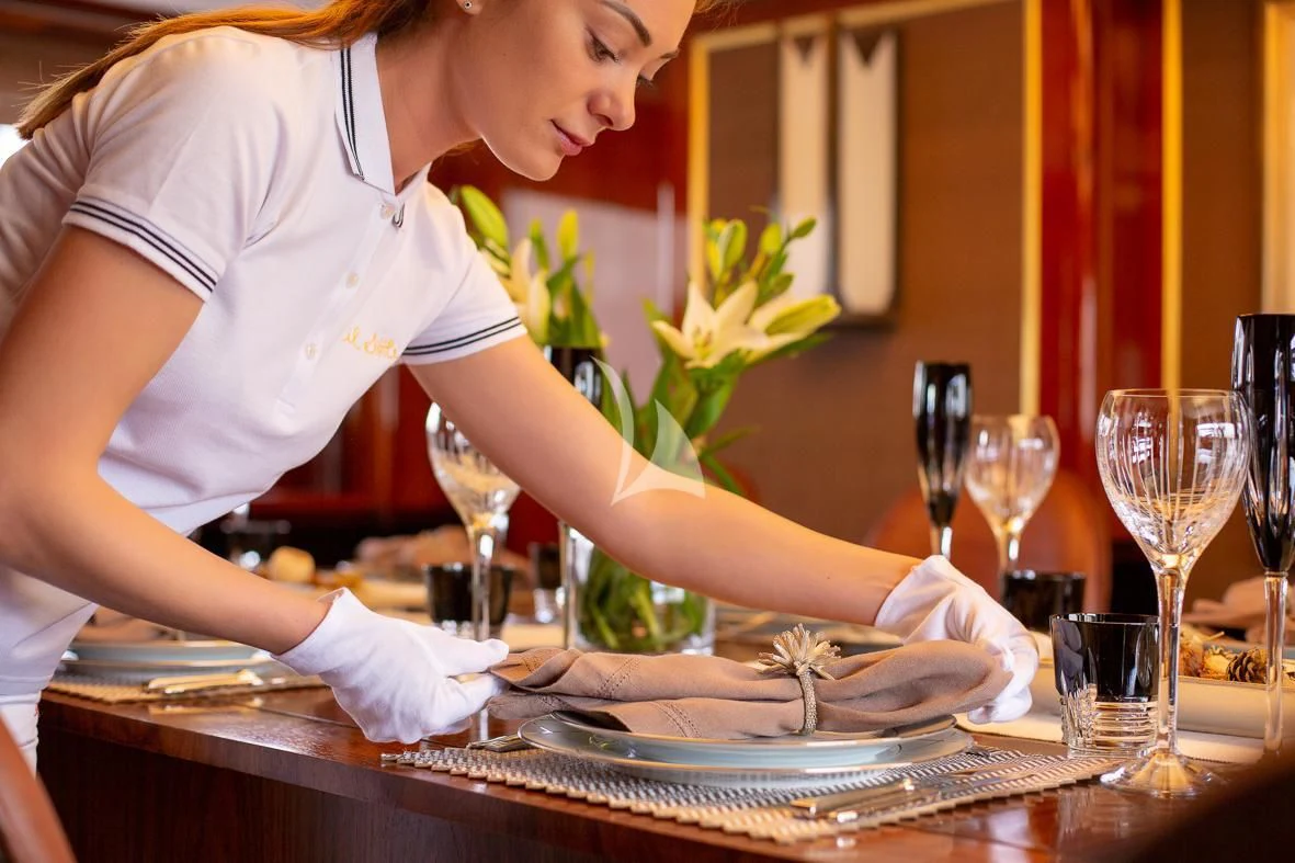 a person preparing food in a kitchen aboard IL SOLE Yacht for Sale