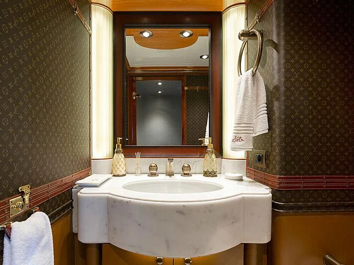 a bathroom with a sink and mirror aboard IL SOLE Yacht for Sale