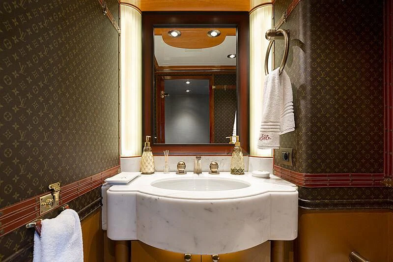 a bathroom with a sink and mirror aboard IL SOLE Yacht for Sale