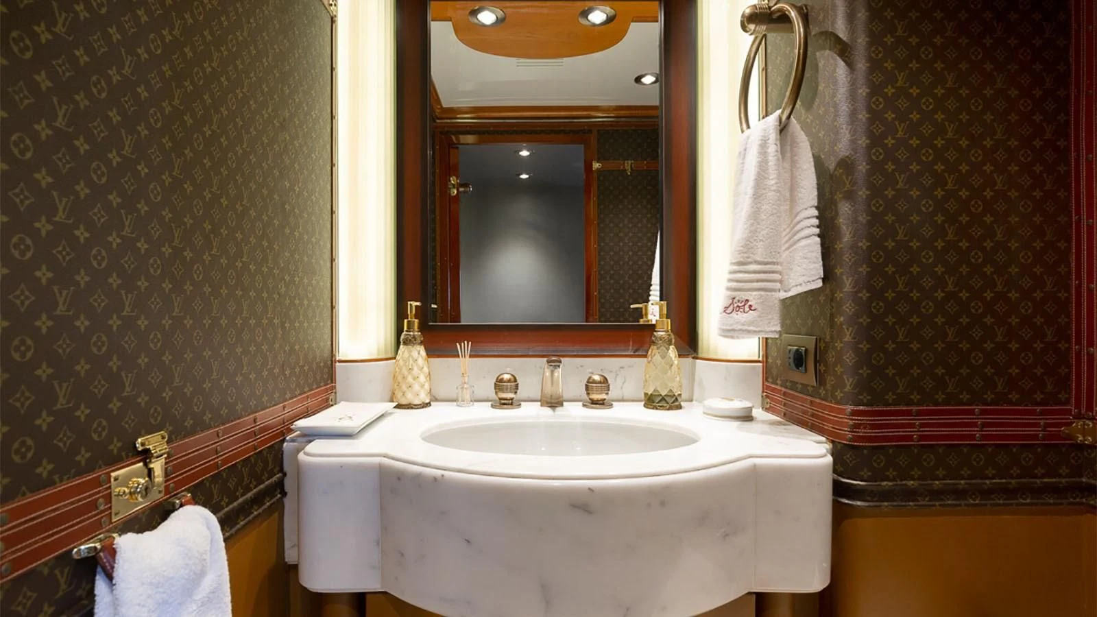 a bathroom with a sink and mirror aboard IL SOLE Yacht for Sale