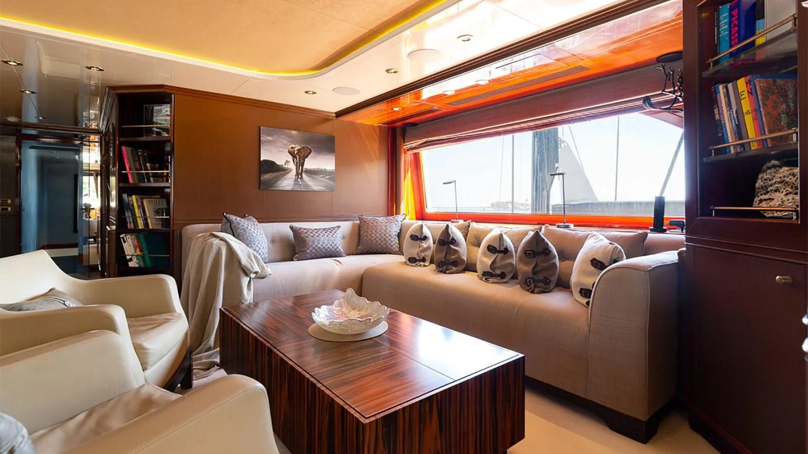 a living room with a couch and a table aboard IL SOLE Yacht for Sale