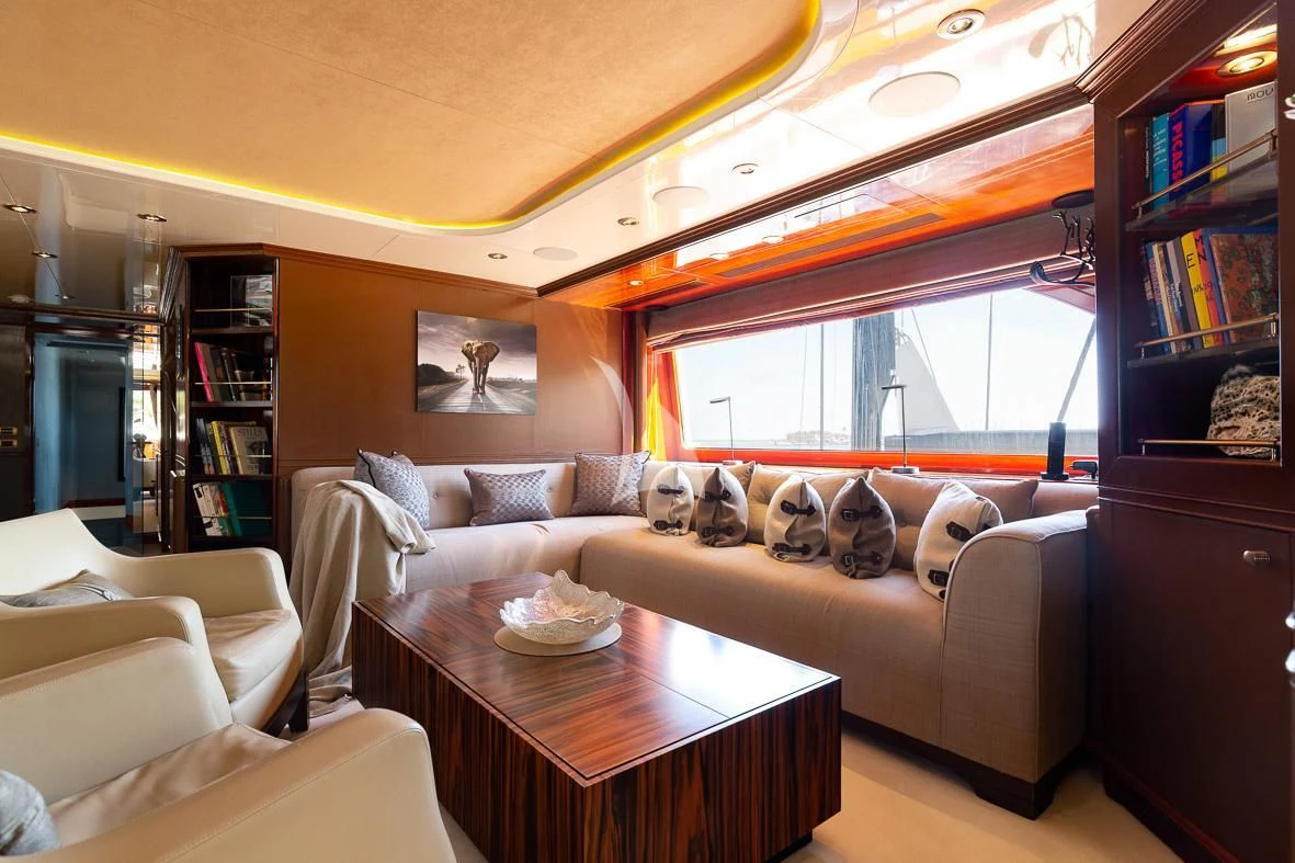 a living room with a couch and a table aboard IL SOLE Yacht for Sale