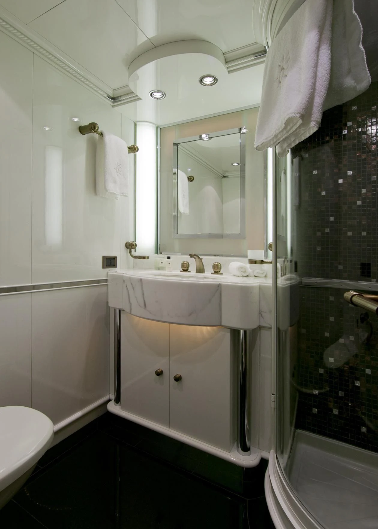 a bathroom with a sink and mirror aboard IL SOLE Yacht for Sale