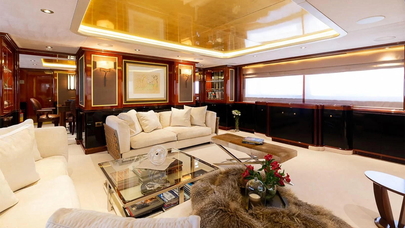 a living room with a large window aboard IL SOLE Yacht for Sale