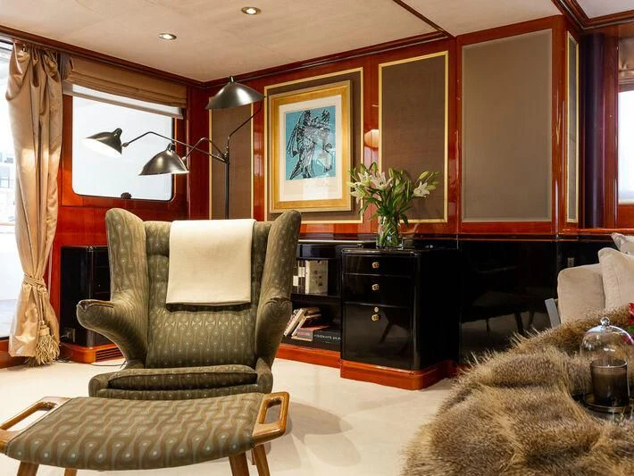 a living room with a chair and a couch aboard IL SOLE Yacht for Sale