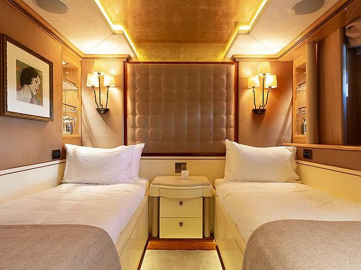 a room with two beds aboard IL SOLE Yacht for Sale