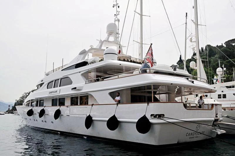 a white boat with black wheels aboard IL SOLE Yacht for Sale