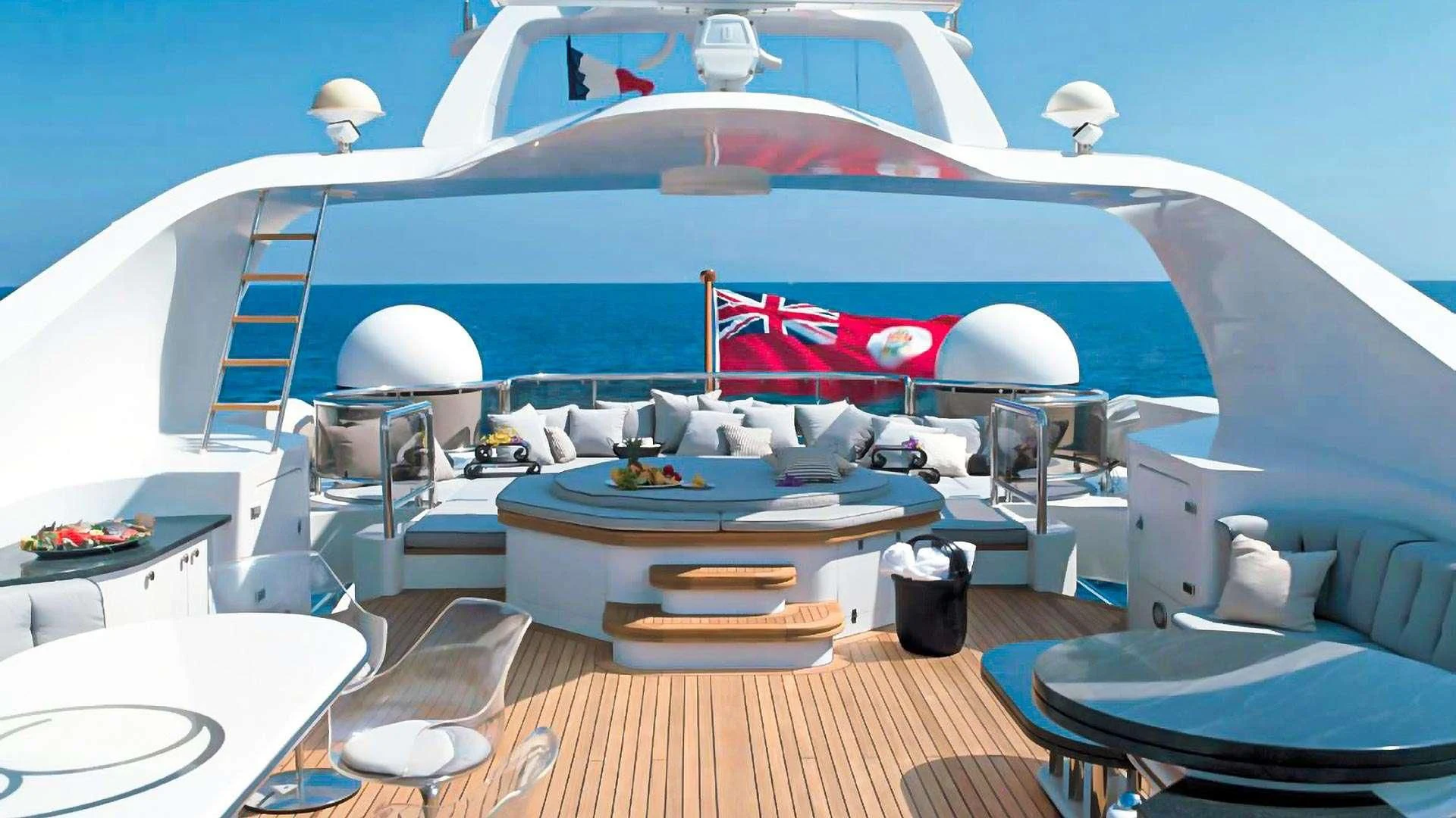 a large white boat with a red stripe on the front aboard IL SOLE Yacht for Sale
