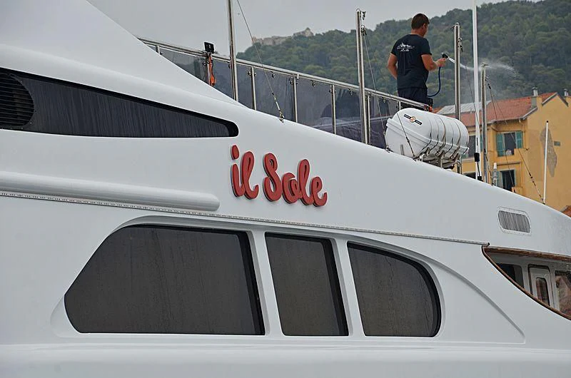 a person standing on a boat aboard IL SOLE Yacht for Sale