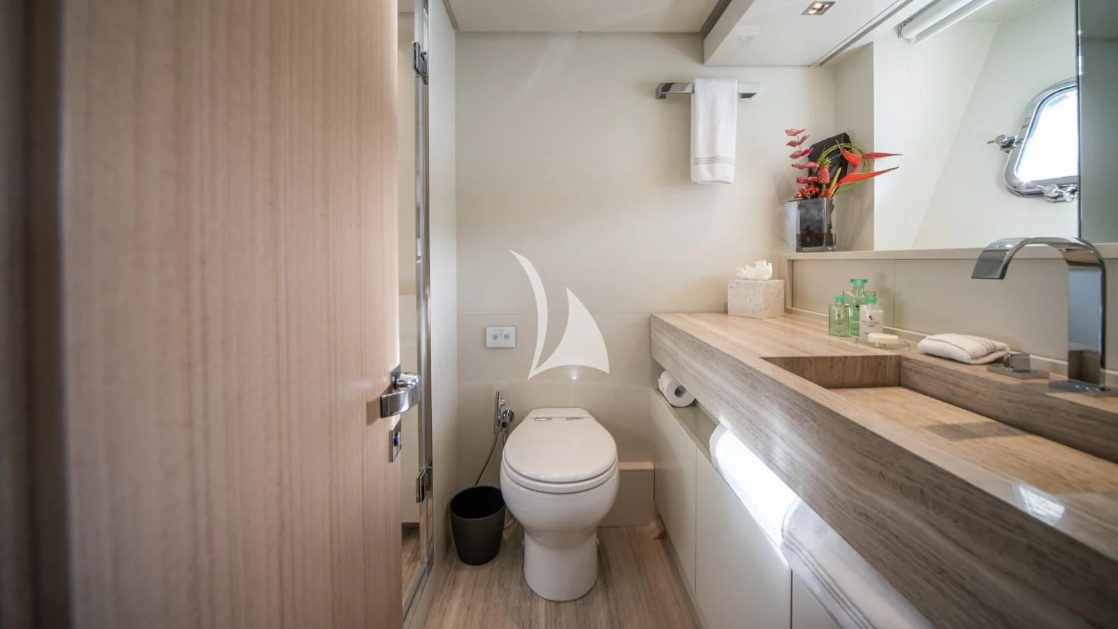a bathroom with a toilet and a sink aboard SQUALO Yacht for Sale