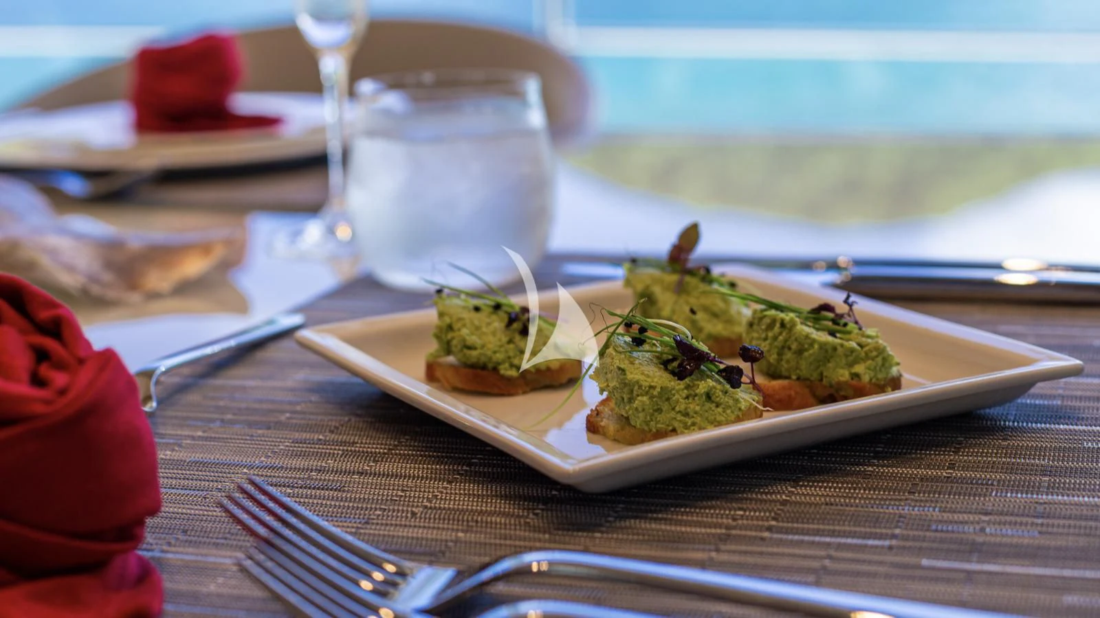 a plate of food aboard SQUALO Yacht for Sale