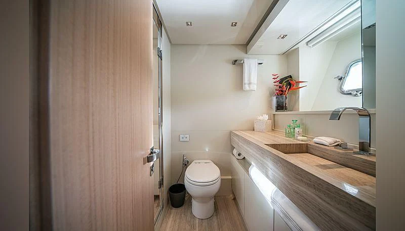 a bathroom with a toilet and a sink aboard SQUALO Yacht for Sale