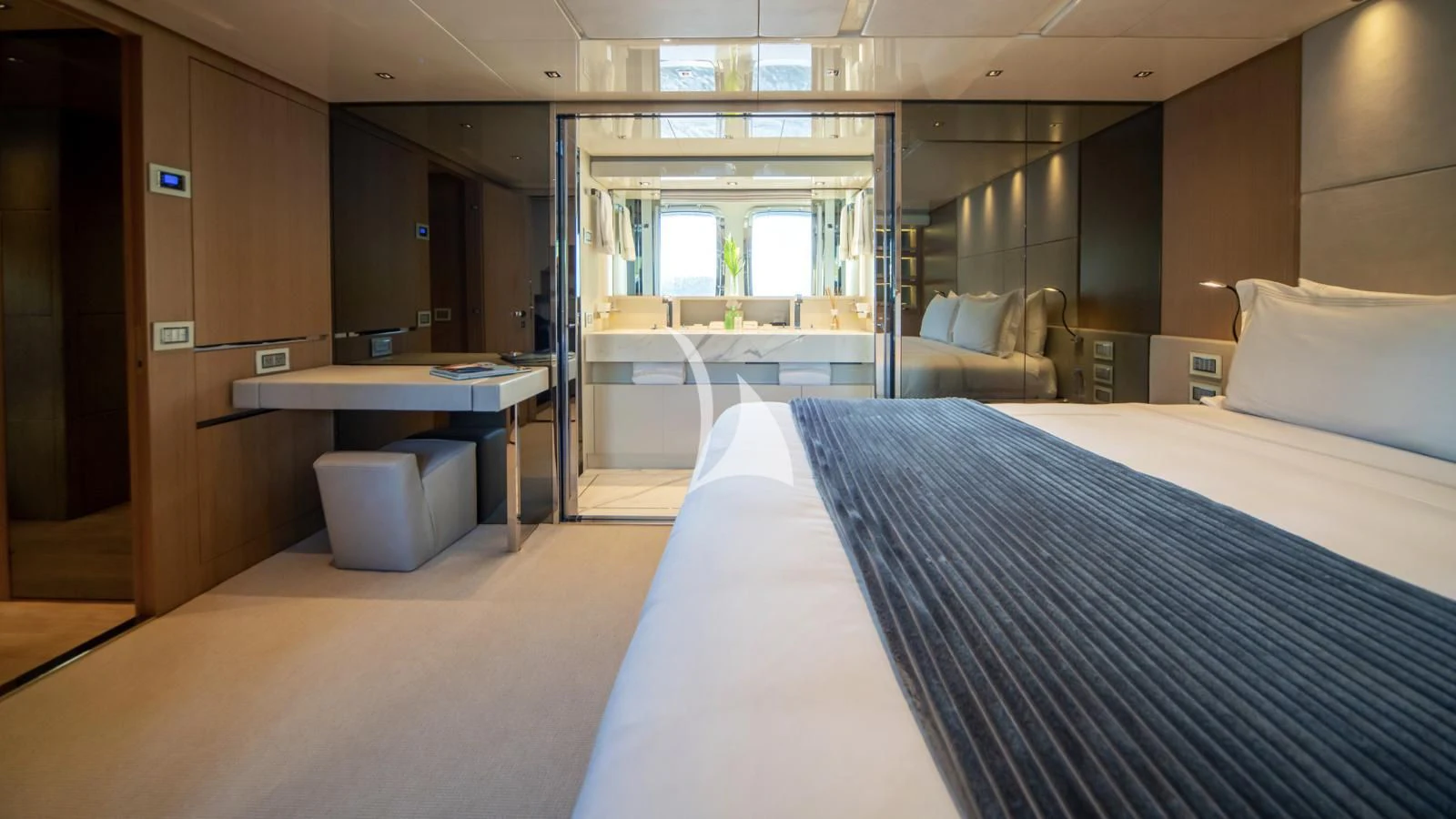 a room with a bed and a desk aboard SQUALO Yacht for Sale