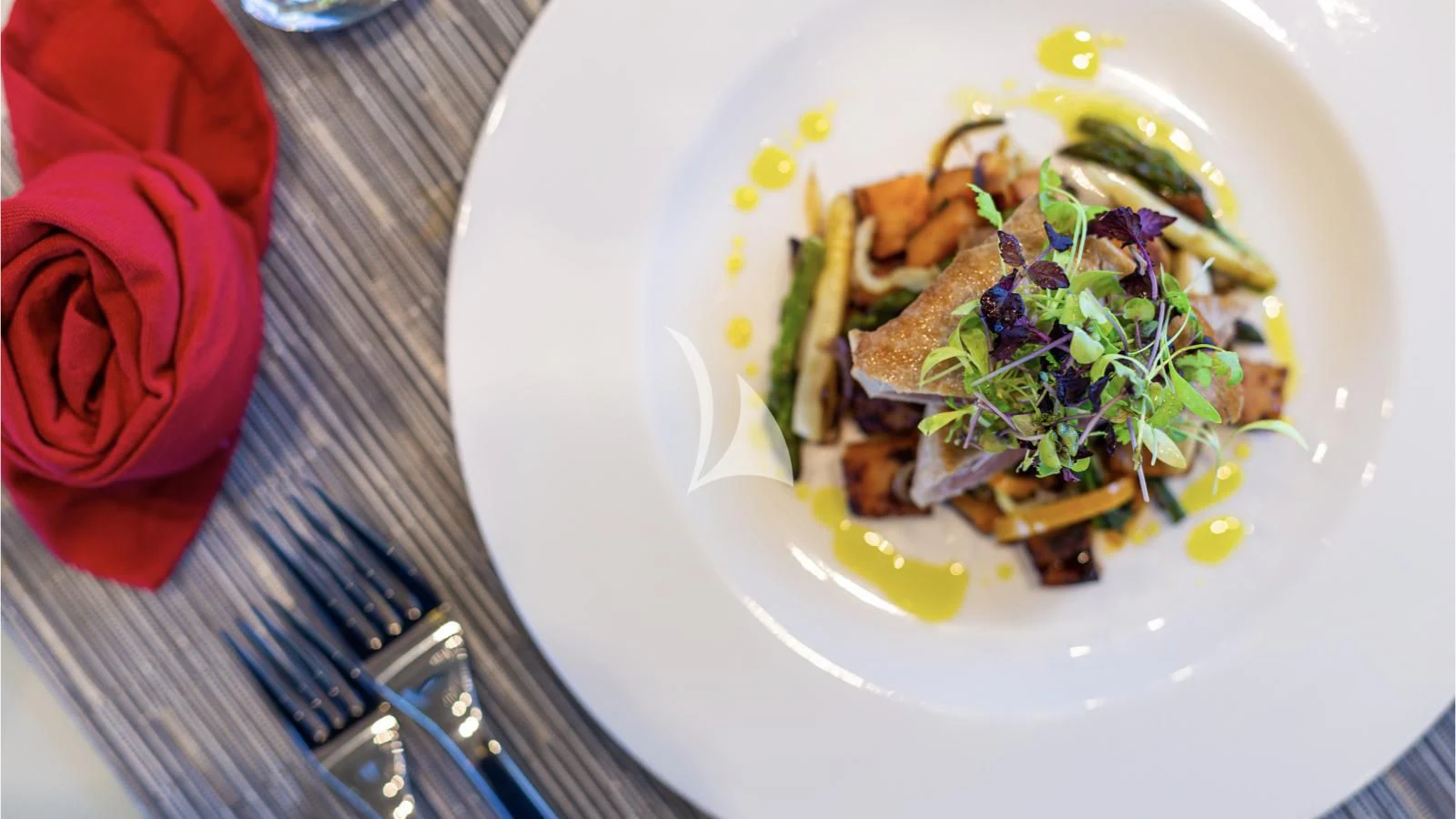 a plate of food aboard SQUALO Yacht for Sale