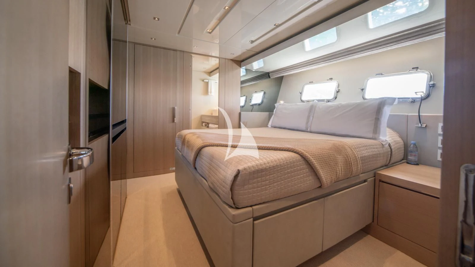 a bed in a room aboard SQUALO Yacht for Sale