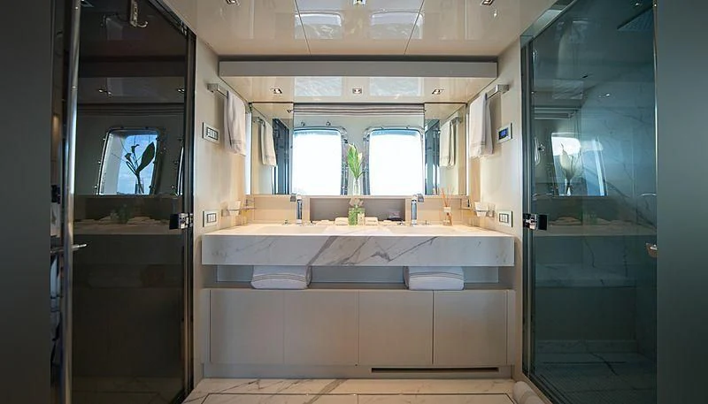a bathroom with a large window aboard SQUALO Yacht for Sale