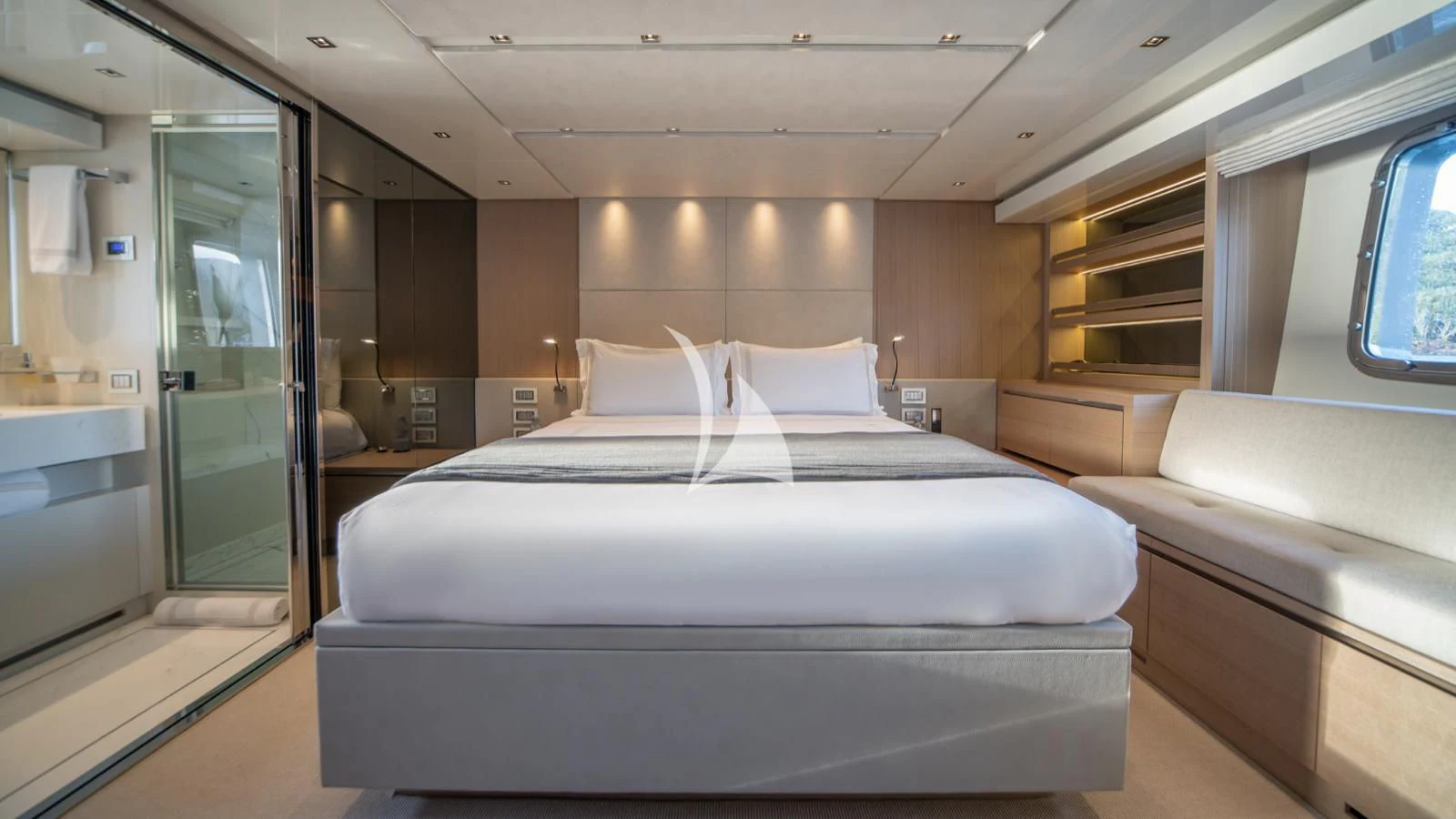 a room with a bed and a window aboard SQUALO Yacht for Sale