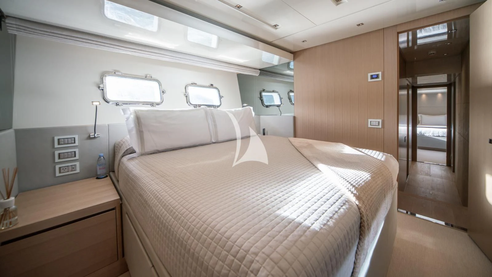 a bed in a room aboard SQUALO Yacht for Sale