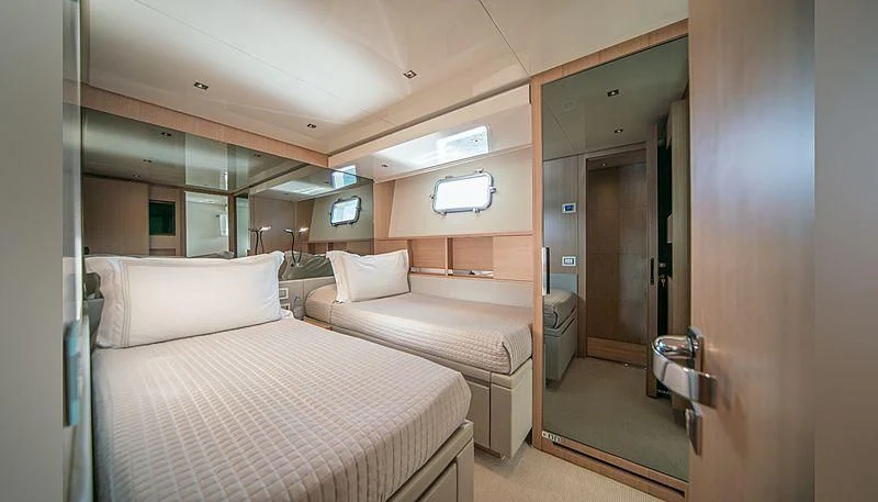 a room with two beds aboard SQUALO Yacht for Sale
