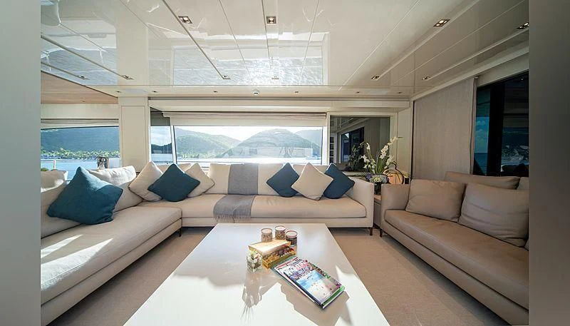 a living room with a large window aboard SQUALO Yacht for Sale
