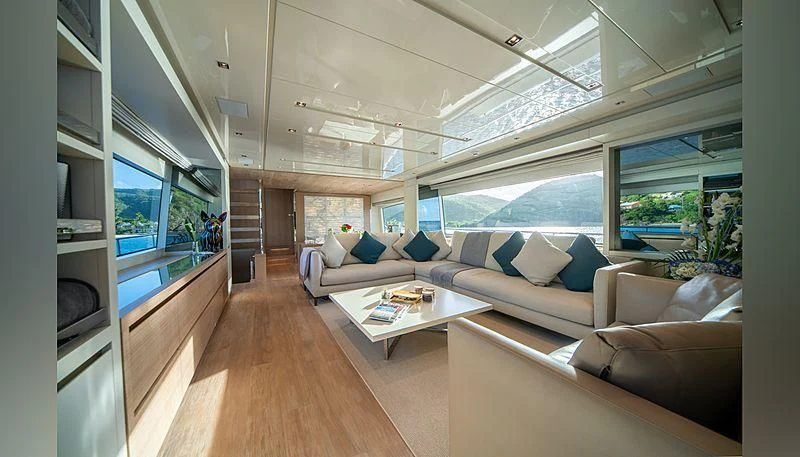 a living room with a large window aboard SQUALO Yacht for Sale