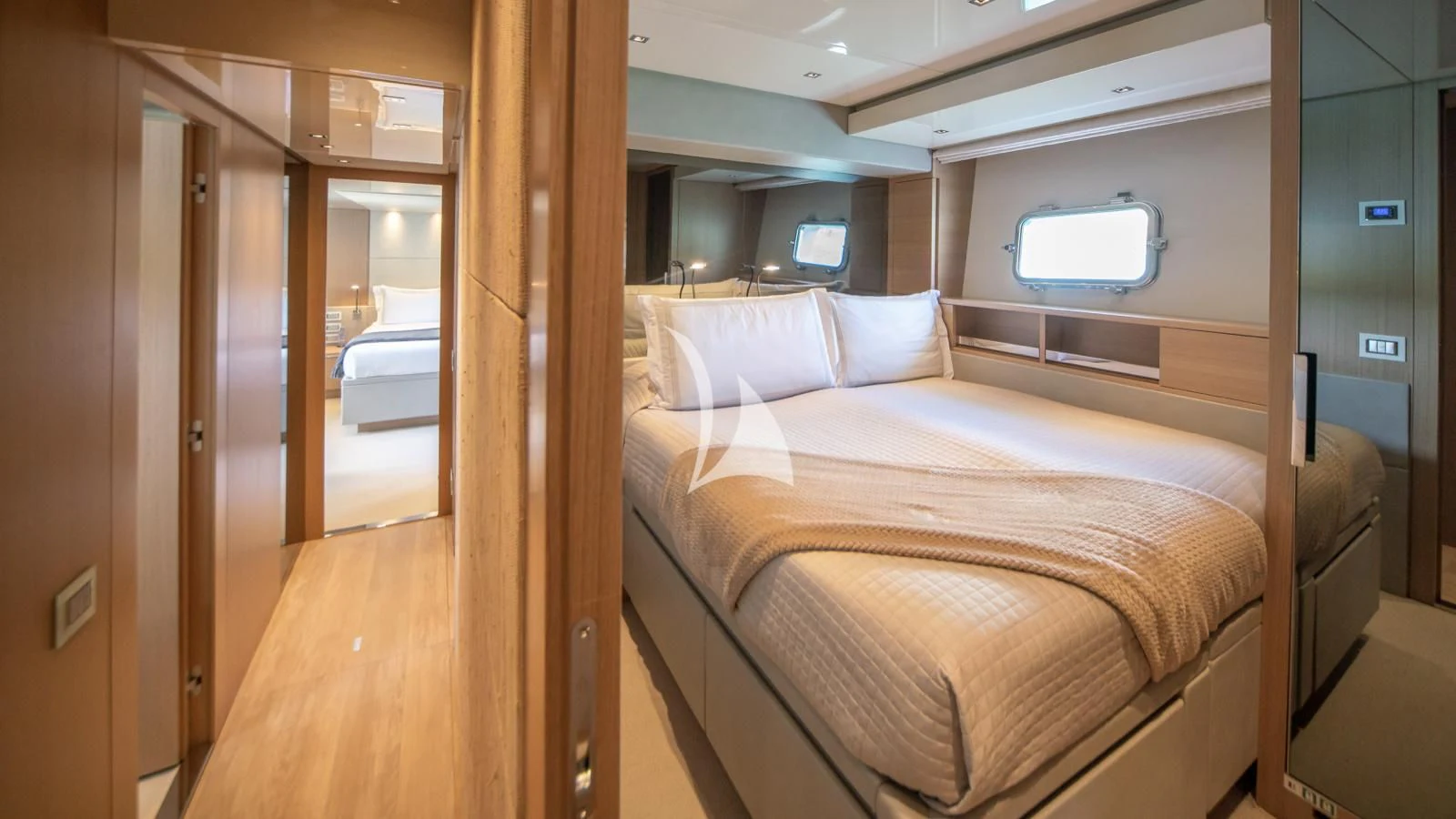 a bed in a room aboard SQUALO Yacht for Sale