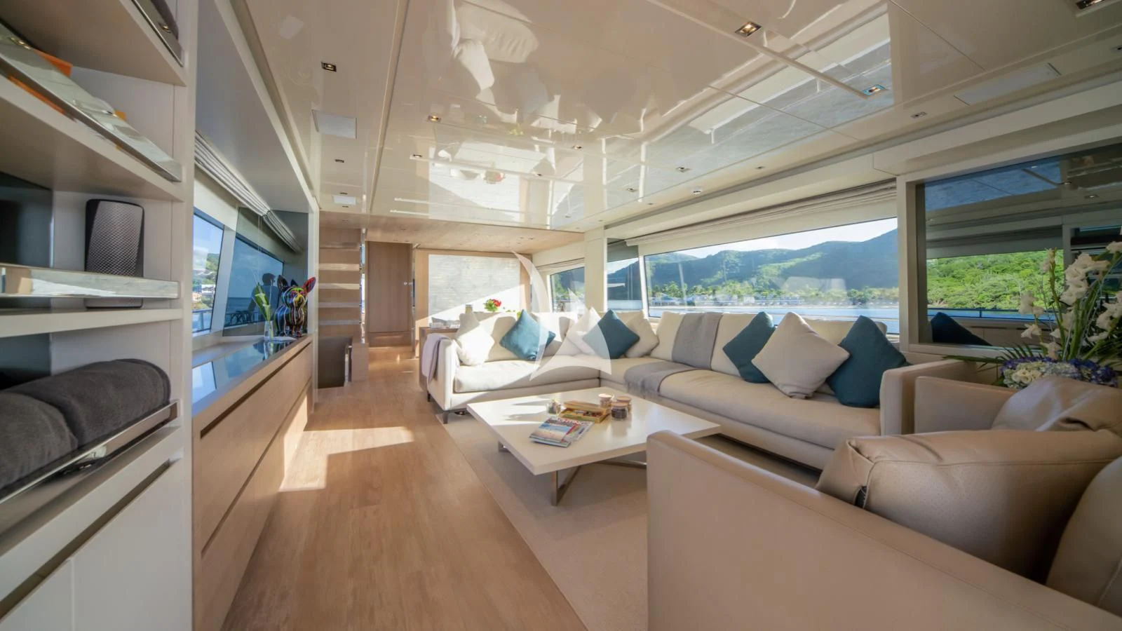 a living room with a large window aboard SQUALO Yacht for Sale