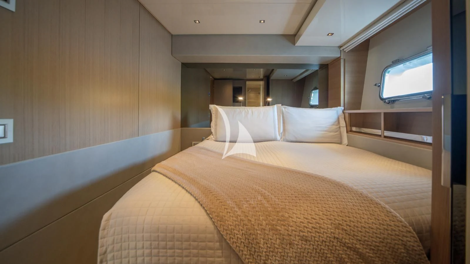 a bed with white sheets aboard SQUALO Yacht for Sale