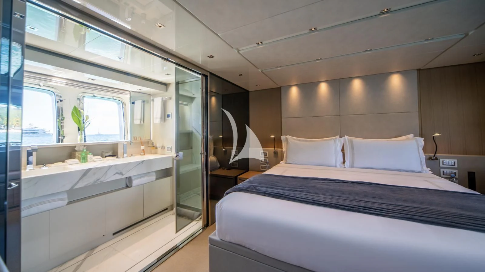 a room with a bed and a bathtub aboard SQUALO Yacht for Sale