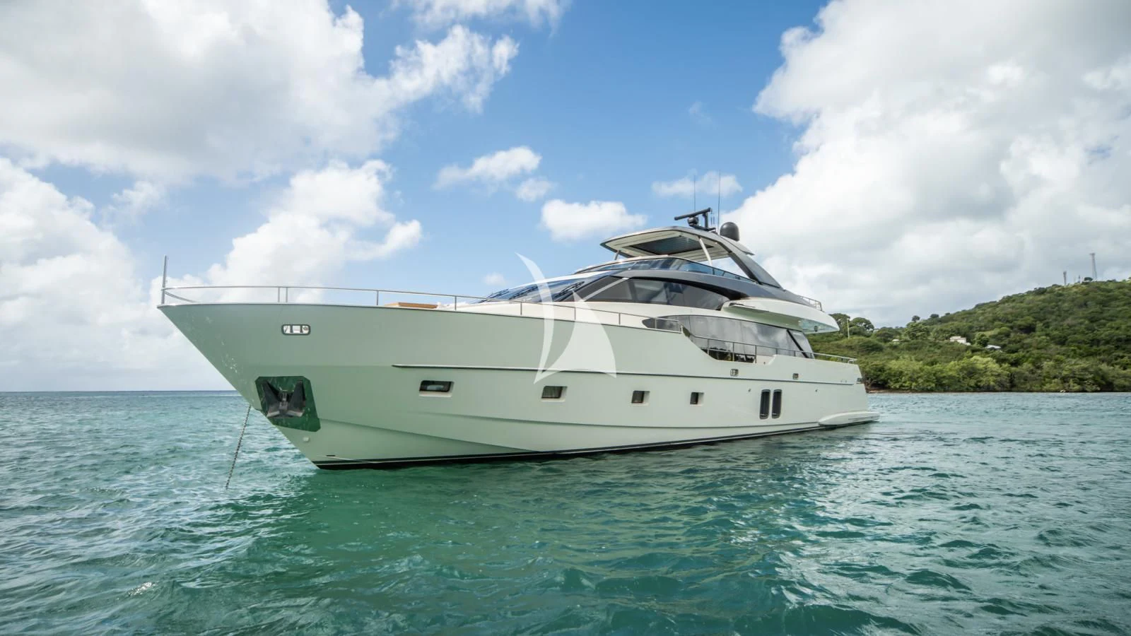 a white boat in the water aboard SQUALO Yacht for Sale