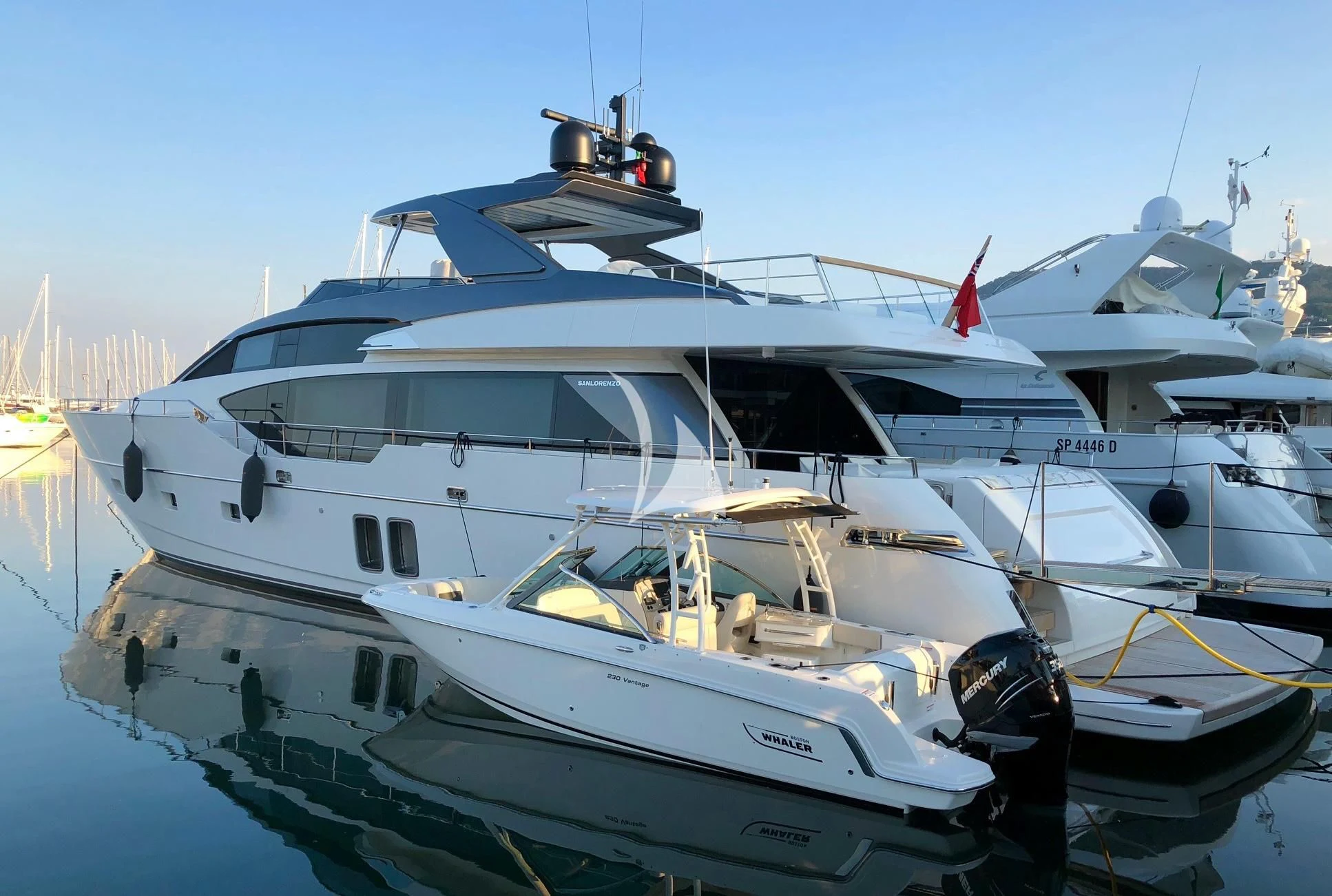 a white yacht on the water aboard SQUALO Yacht for Sale