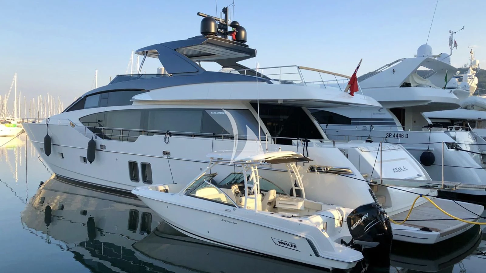a white yacht docked aboard SQUALO Yacht for Sale