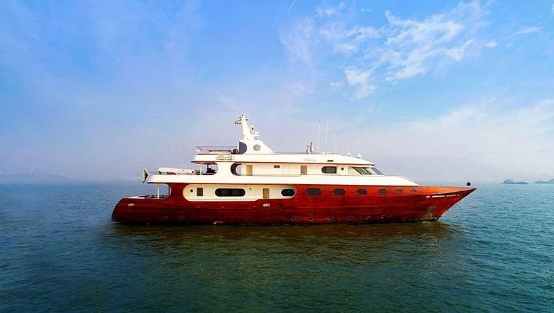 a red and white boat in the water aboard ASHENA Yacht for Charter