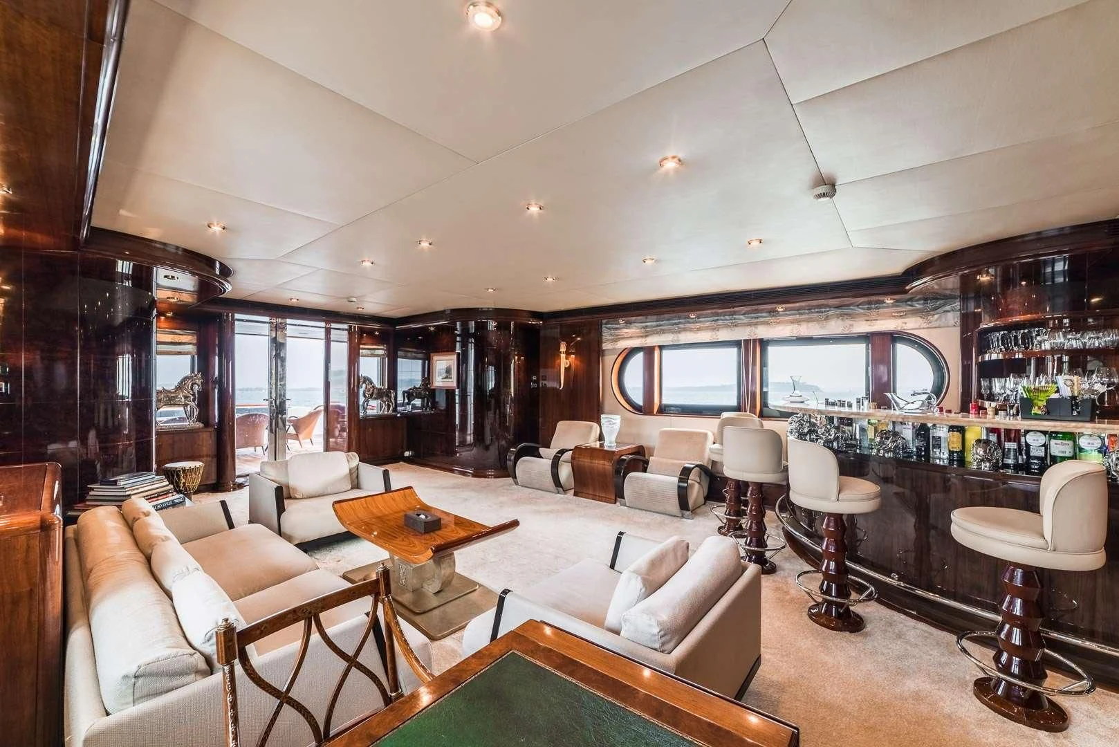 a living room with a large window aboard ASHENA Yacht for Charter