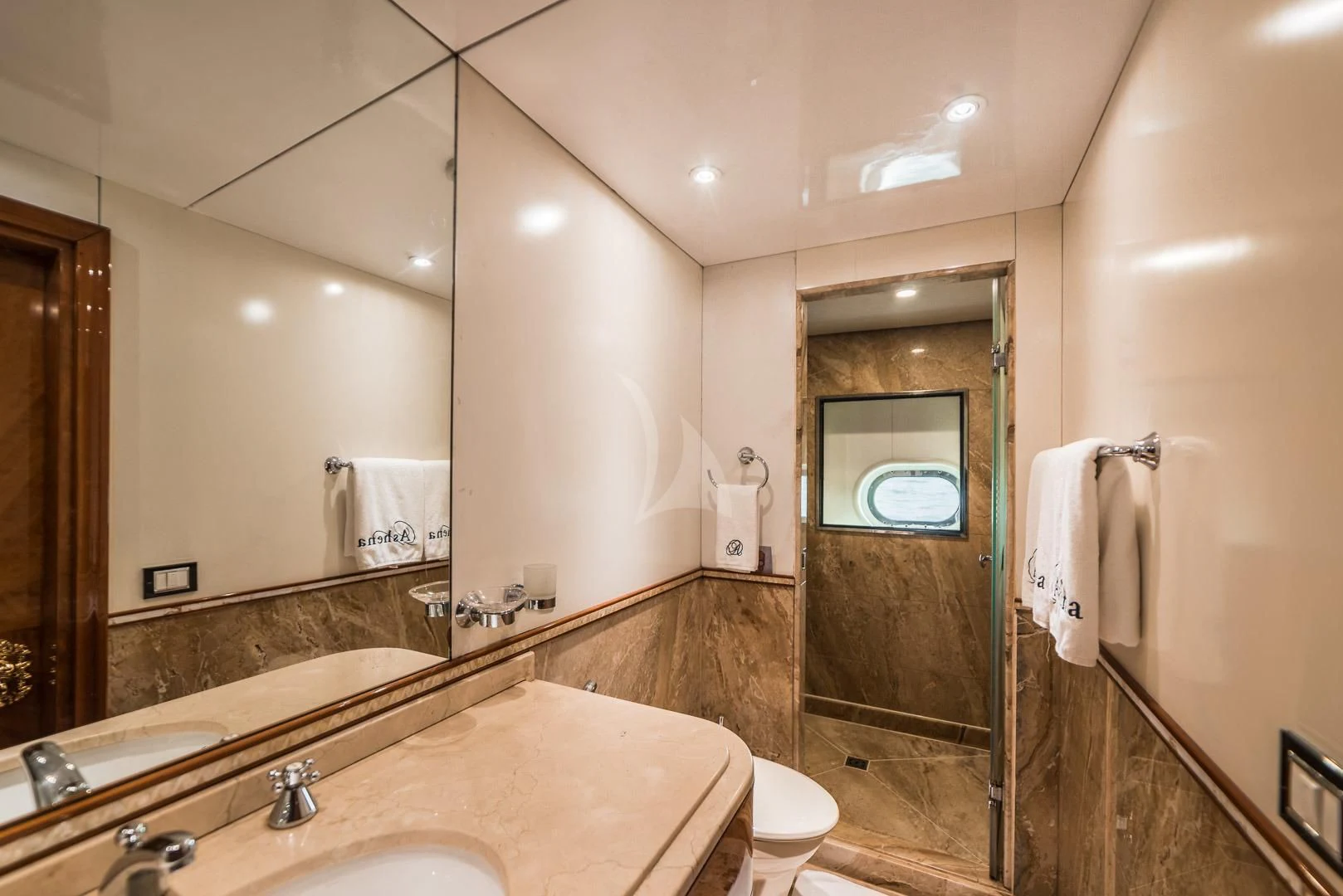 a bathroom with a large mirror aboard ASHENA Yacht for Charter
