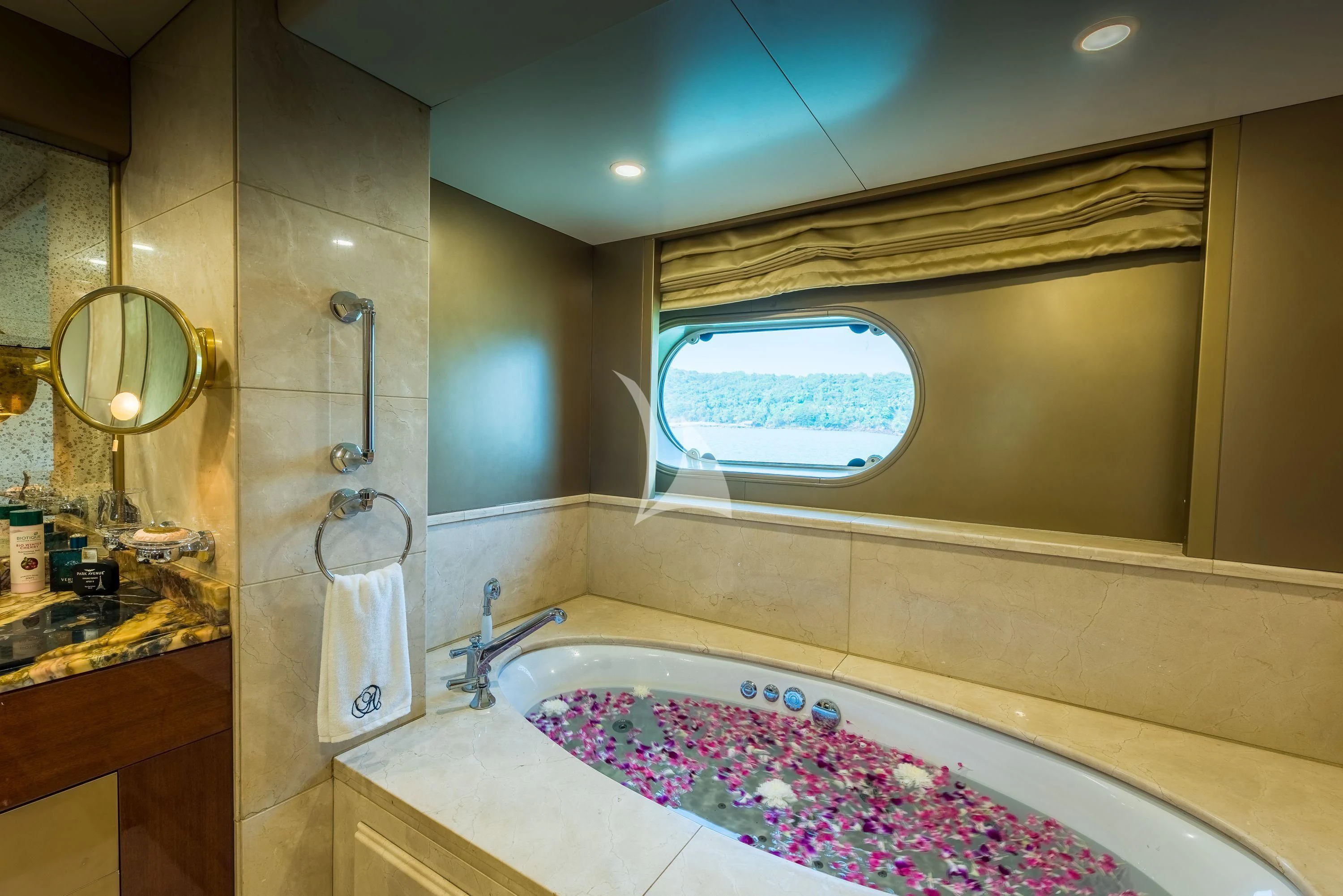 a bathroom with a tub and a sink aboard ASHENA Yacht for Charter