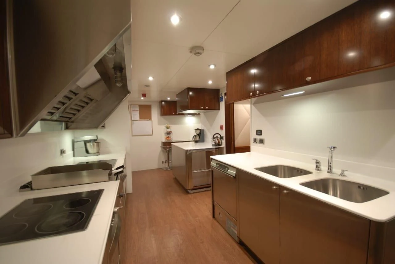 a kitchen with a stove and sink aboard ASHENA Yacht for Charter
