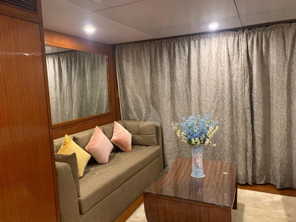 a living room with a couch and a table aboard ASHENA Yacht for Charter